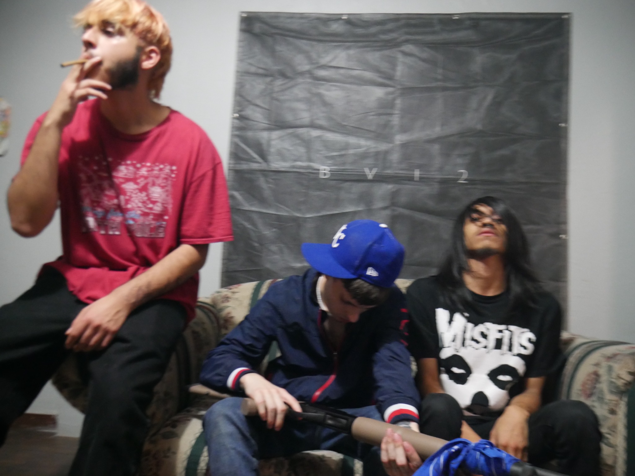 CUTTA MOB sitting together in a room